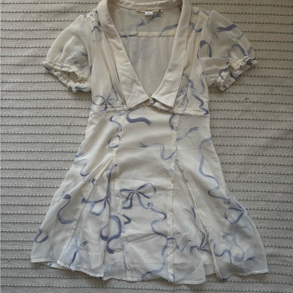 white minidress with purple bows